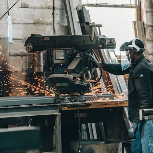 Machinist working at a factory bench
