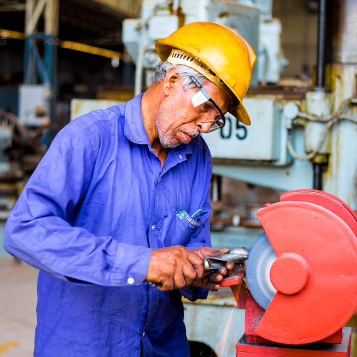 Machinist finishing a metal part